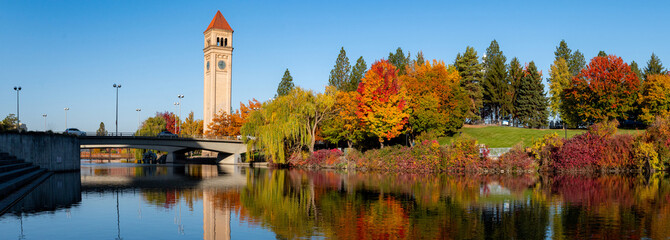 Panorama of Spokane River Reflecting a Colorful Riverfront Park during Autumn in Downtown Spokane,...