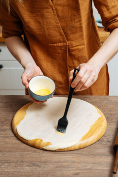 Crop woman chef making Indian flatbread at home