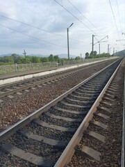 railway track, rails in the distance, road