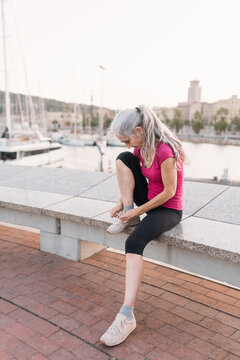 Senior Woman Tying Shoes