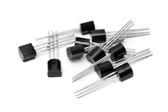 several TO92 type transistors on white background