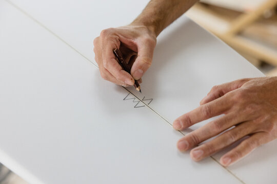 surf shaper signing surf board