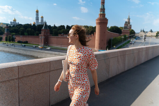Young modern woman near Moscow Kremlin