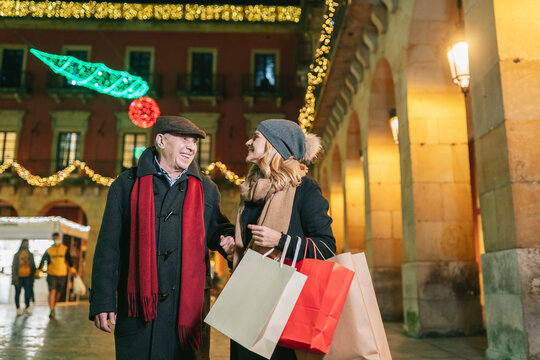 Elderly man with daughter enjoying Christmas time