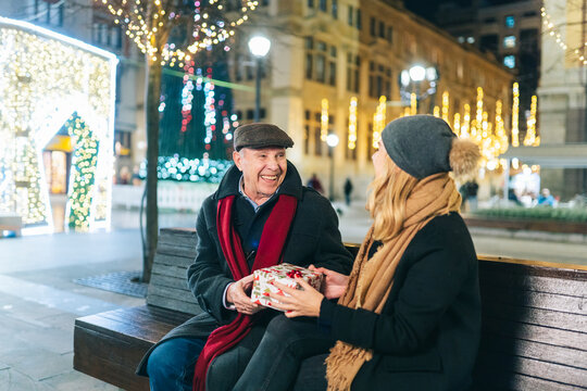 Mature couple exchanging Christmas presents