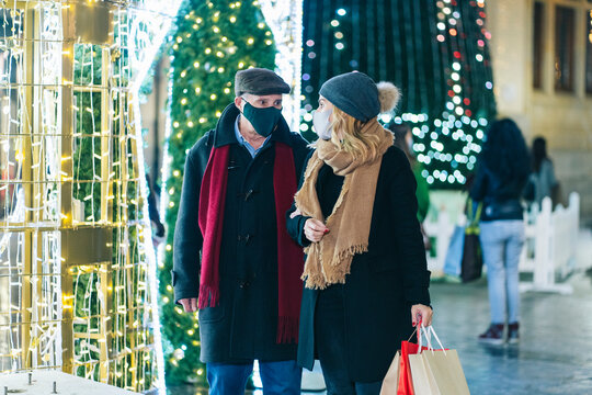 Couple strolling in Christmas city