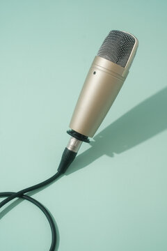 Silver Microphone On The Pastel Green Background