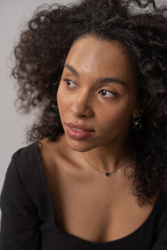 Minimalistic portrait of a dark-skinned woman