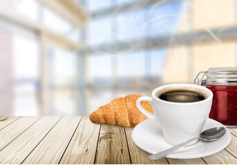 Fresh delicious breakfast with Coffee, crispy croissants on desk