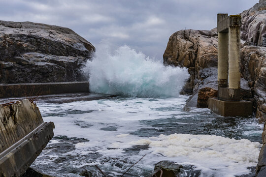 Waves crushing on abandoned buildings on the coast