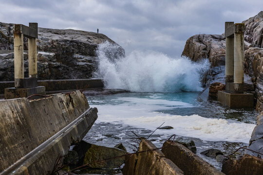 Waves crushing on abandoned buildings on the coast