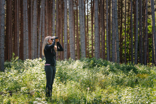 Woman birder looking for birds