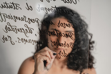 Female Artist Doing Calligraphy on Glass