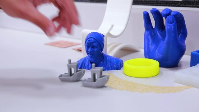 3D printed shapes in different colors, blue and yellow silver and white