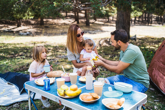 Family having picnic on campsite