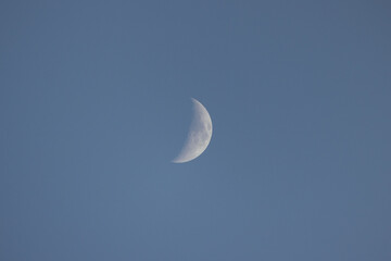 half moon in blue sky