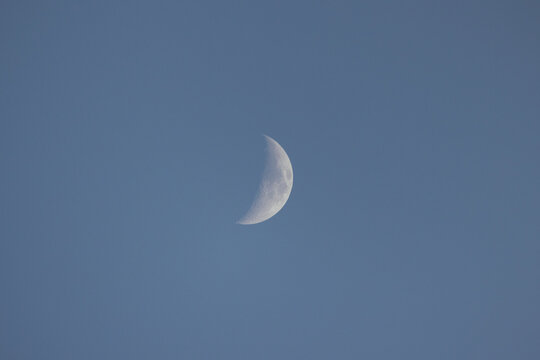 half moon in blue sky - Powered by Adobe