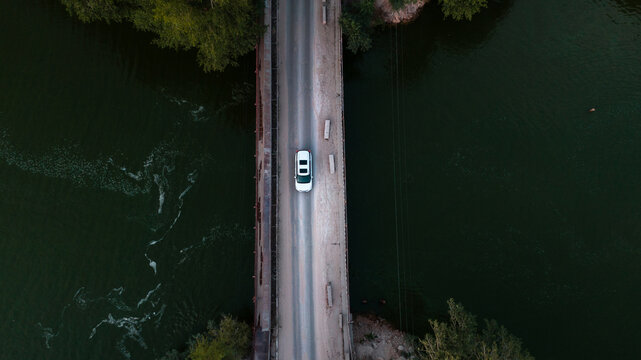 Overhead  Shot Of A Brand New Car Crossing The Bridge