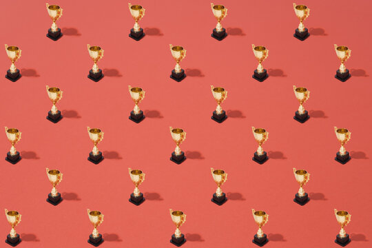 Golden Trophy Pattern On Red Background
