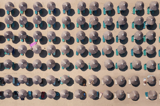 tourism, summer beach umbrellas and sunbeds from above