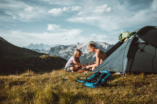 father and son in the mountains
