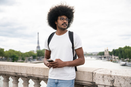 Man Holding Smartphone In Paris