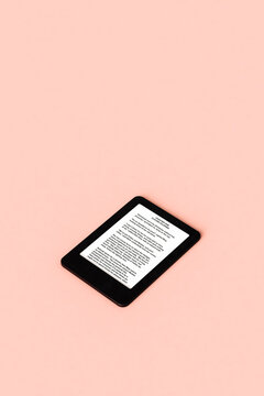 one Ebook Reader on pink background