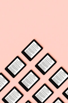 Ebook Reader on pink background with copy space