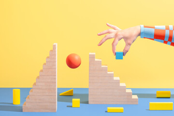 Hand with wooden stairs