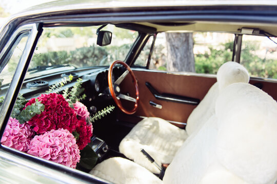 Flowers in passenger seat of old car