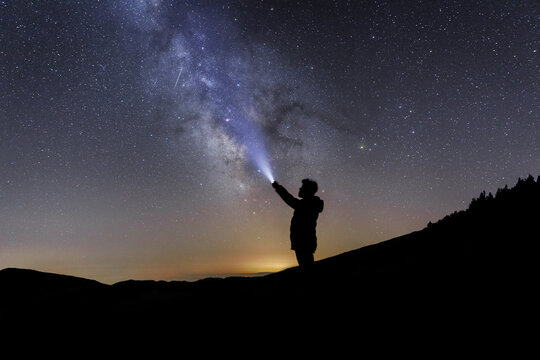 Silhouette of a man under the starry sky