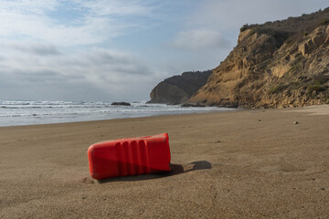 Plastic Gas Can Polluting the beach with a Mountain 