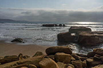 Beautiful Scene of Rocks on the beach during a sunny day