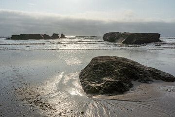 Beautiful Longshot of rocks on the beach and waves