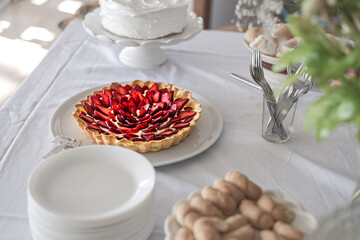 Delicious strawberry tart on the white table in the holiday morning