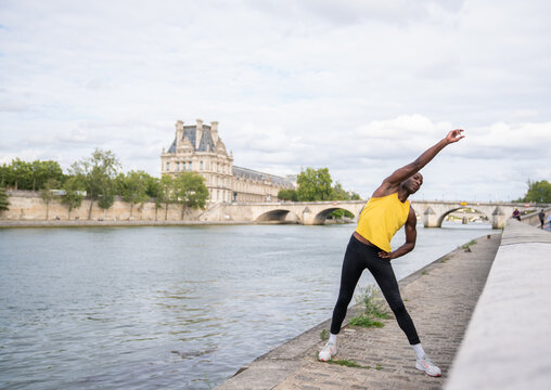 Person Exercising On Riverside