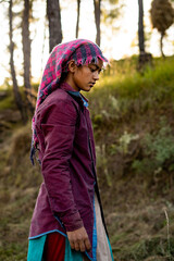 Portrait of an Indian female farmer in traditional dress. Indian girl farmer working in the fields.