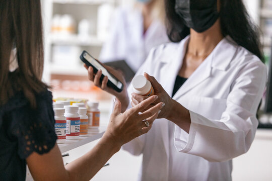RX: Pharmacist Takes Medicine Bottle