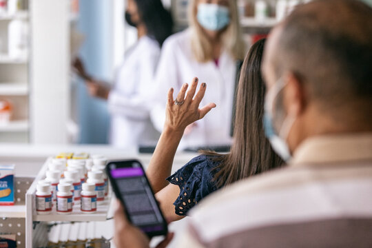 RX: Woman Raises Hand In Queue