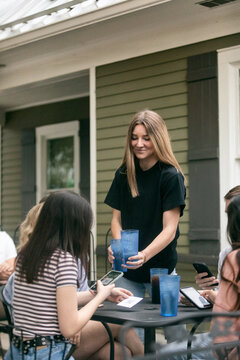 Dining: Server Brings Drinks To Table