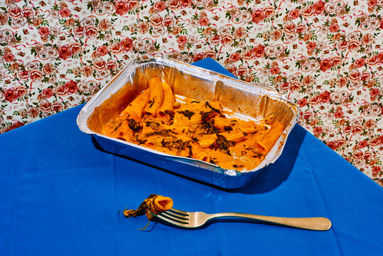 foil tray with pasta leftovers