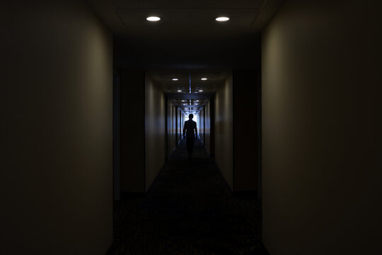Man in a hotel corridor