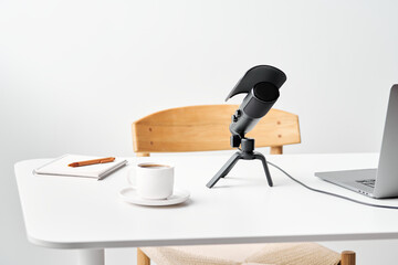 Coffee near podcast recording equipment