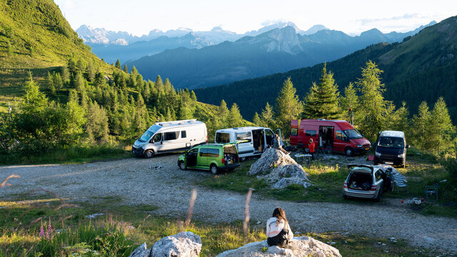 Circle of camper vans on beautiful mountain pass