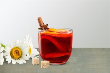 Chamomile tea in a mug with natural small chamomile flowers