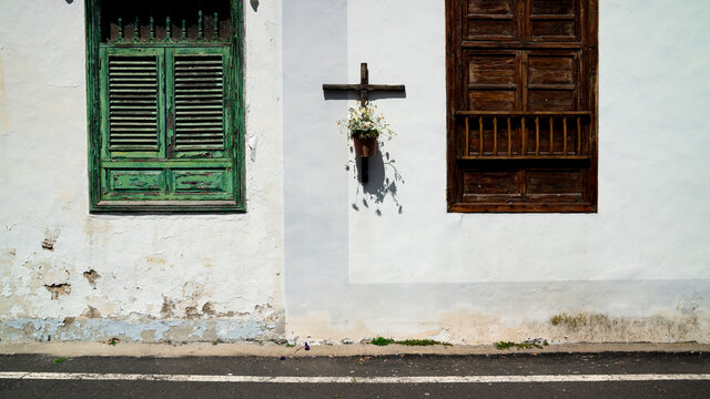 A house wall with a crucifix 