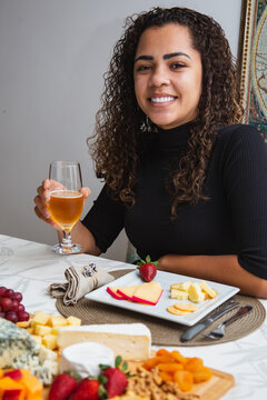 Young Woman Eating Cheese. Woman Eating Cheese Snacks