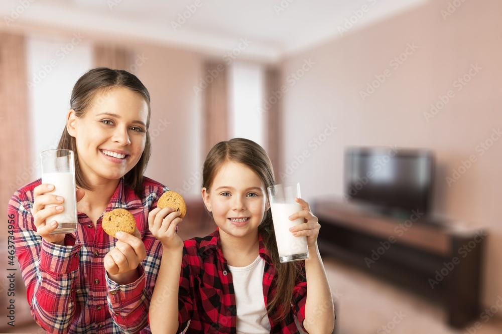 Canvas Prints Healthy Breakfast. Cute Little Girl And Her Smiling mother Eating Homemade Cookies