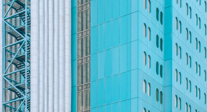 Blue Building Facade With Pipes