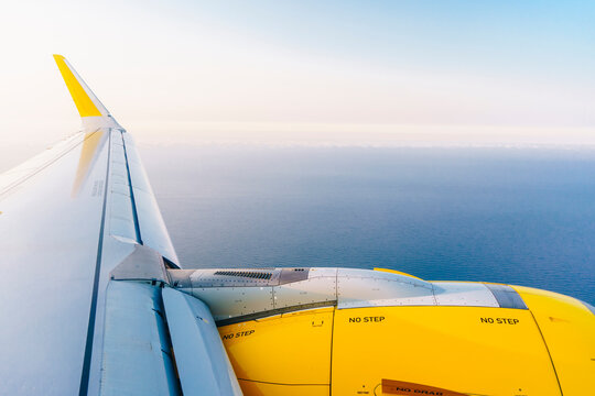 Airplane flying over the sea

